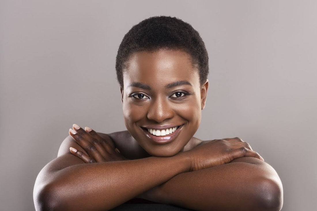 Smiling woman with fitzpatrick skin type VI