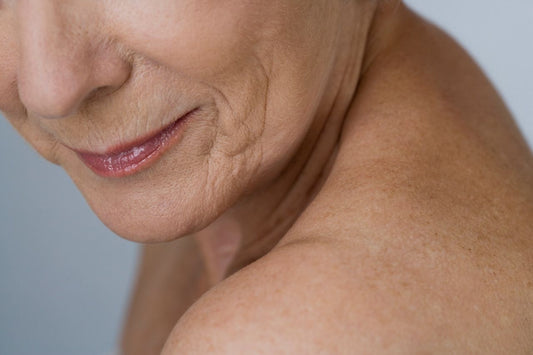 close up of mature skin showing visible texture, fine lines and signs of aging