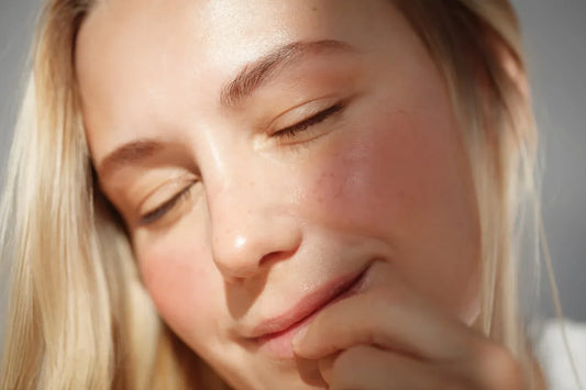 woman showing the beautiful results of a skinimalism routine